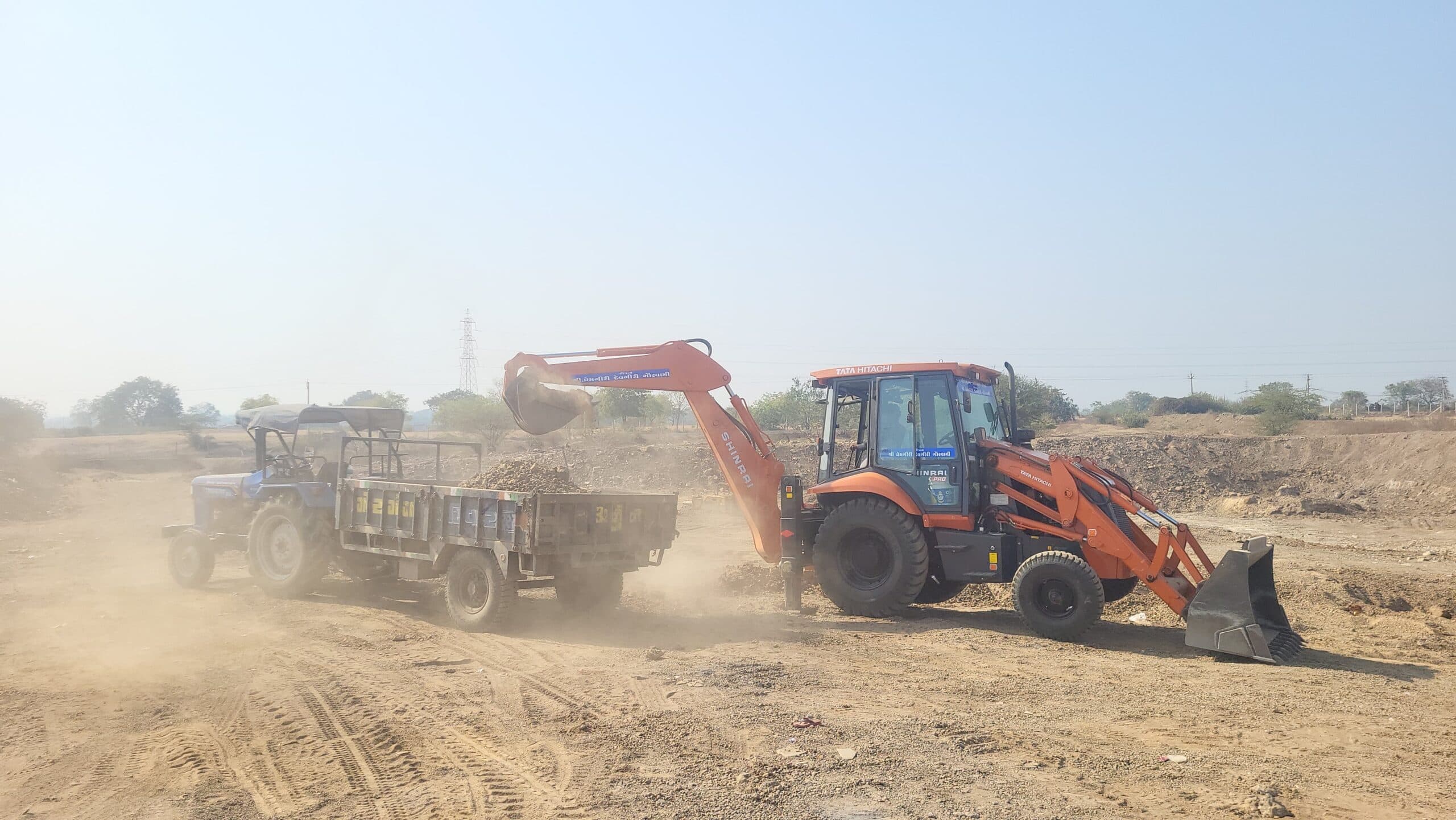 Loader Filling Soil into Tractor